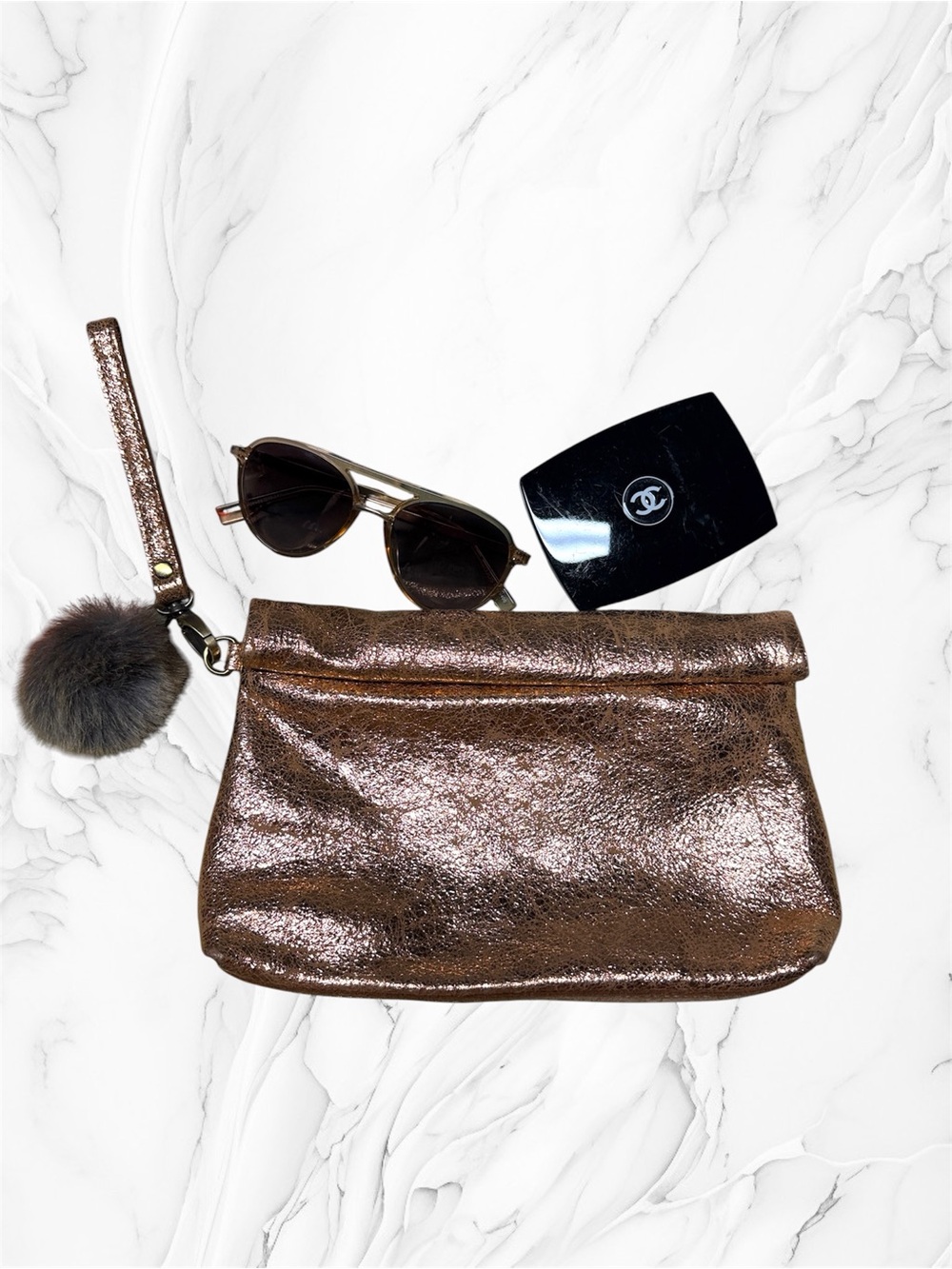 Miss Albright Metallic Rose Gold Wristlet Clutch with Pom Pom Accent